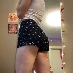 black light floral shorts with zipper and a button